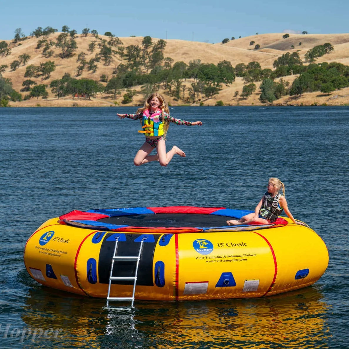 Island Hopper 15ft Classic yellow steel frame spring water trampoline floating on a lake