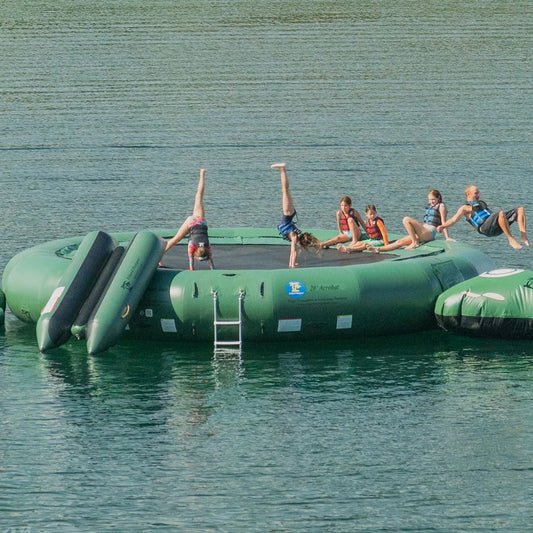 Island Hopper 20ft Acrobat natural green steel frame spring water trampoline floating on a lake