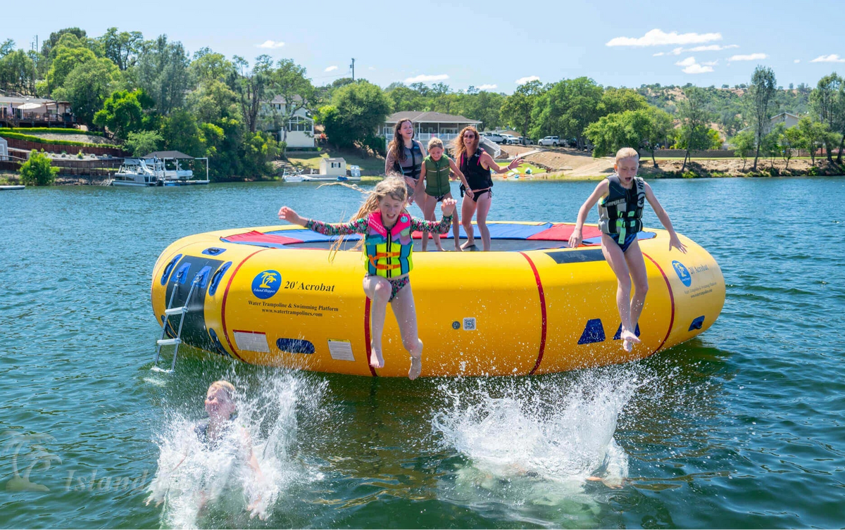 Group on Island Hopper 20ft Acrobat floating lake trampoline with steel frame anchored in open water