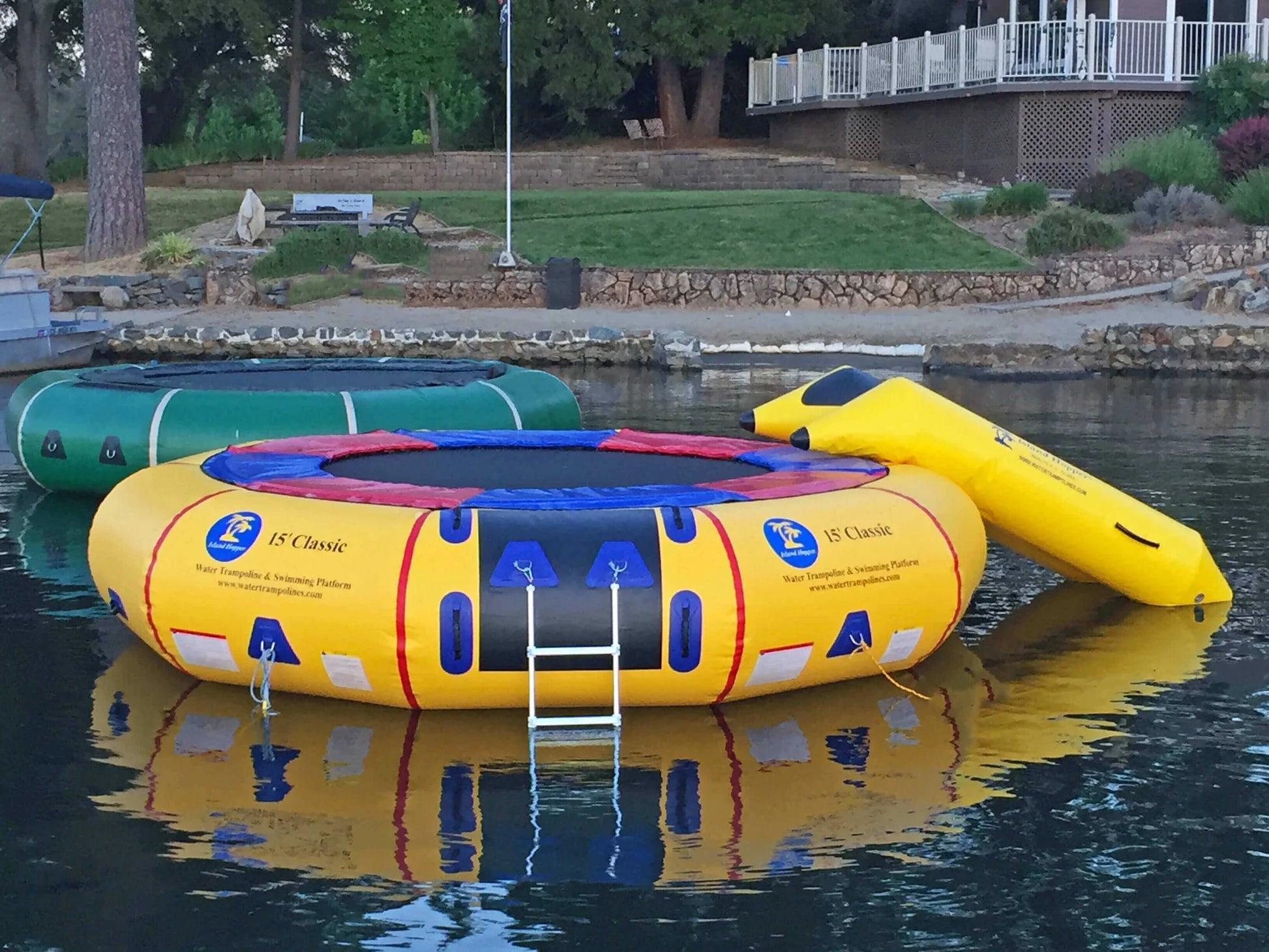  Island Hopper 15ft Classic floating lake trampoline natural green and yellow on lake front property airbnb