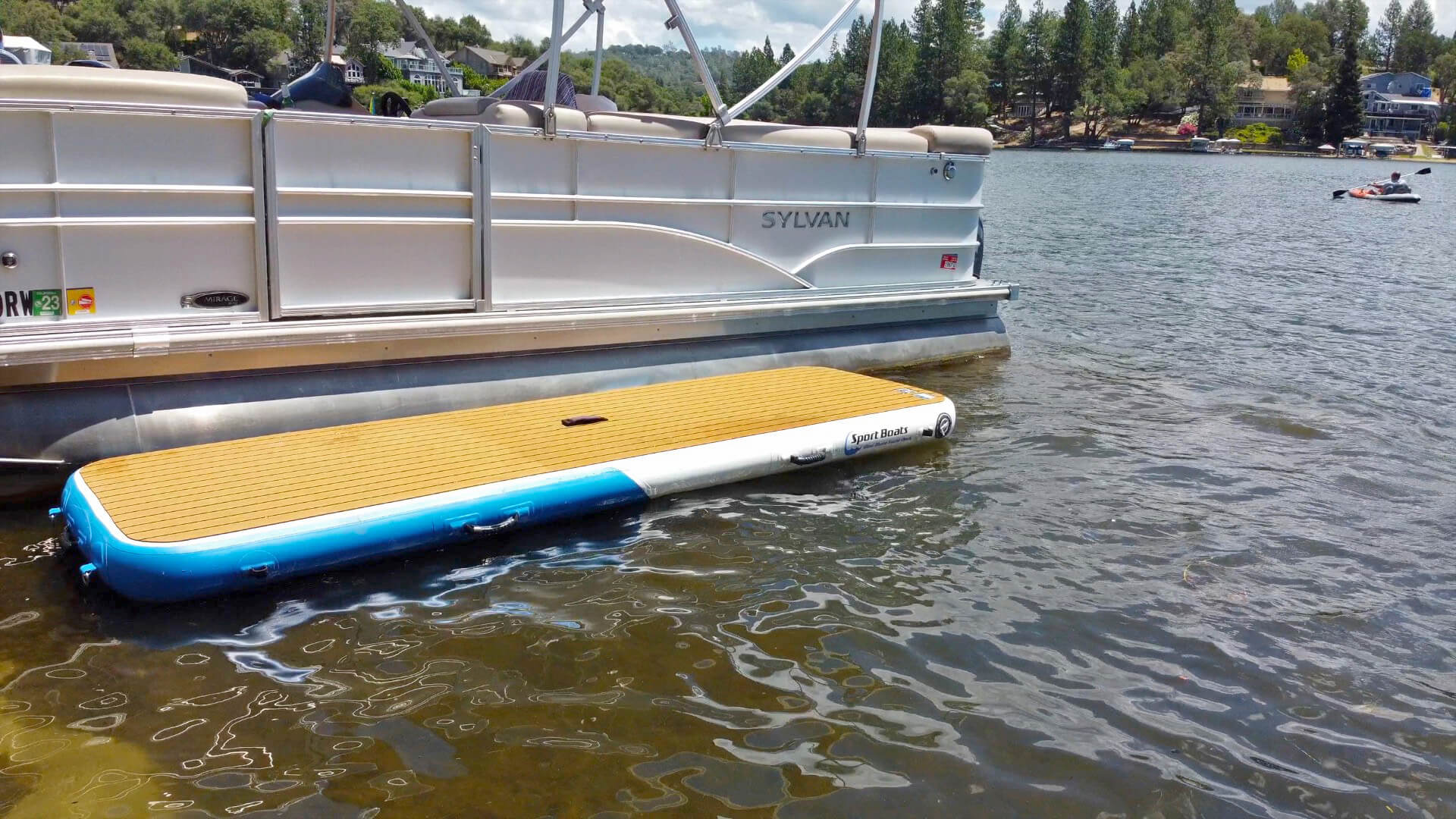 Island Hopper Mini Mate inflatable dock platform 10 x 3 ft slim boat dock alongside sailboat in marina slip